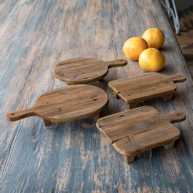 https://www.antiquefarmhouse.com/media/catalog/product/cache/87f7a85cd0f3ed2c3dff34ce326cd3a5/w/o/wooden-cutting-board-risers-set-of-4-min_1.jpg